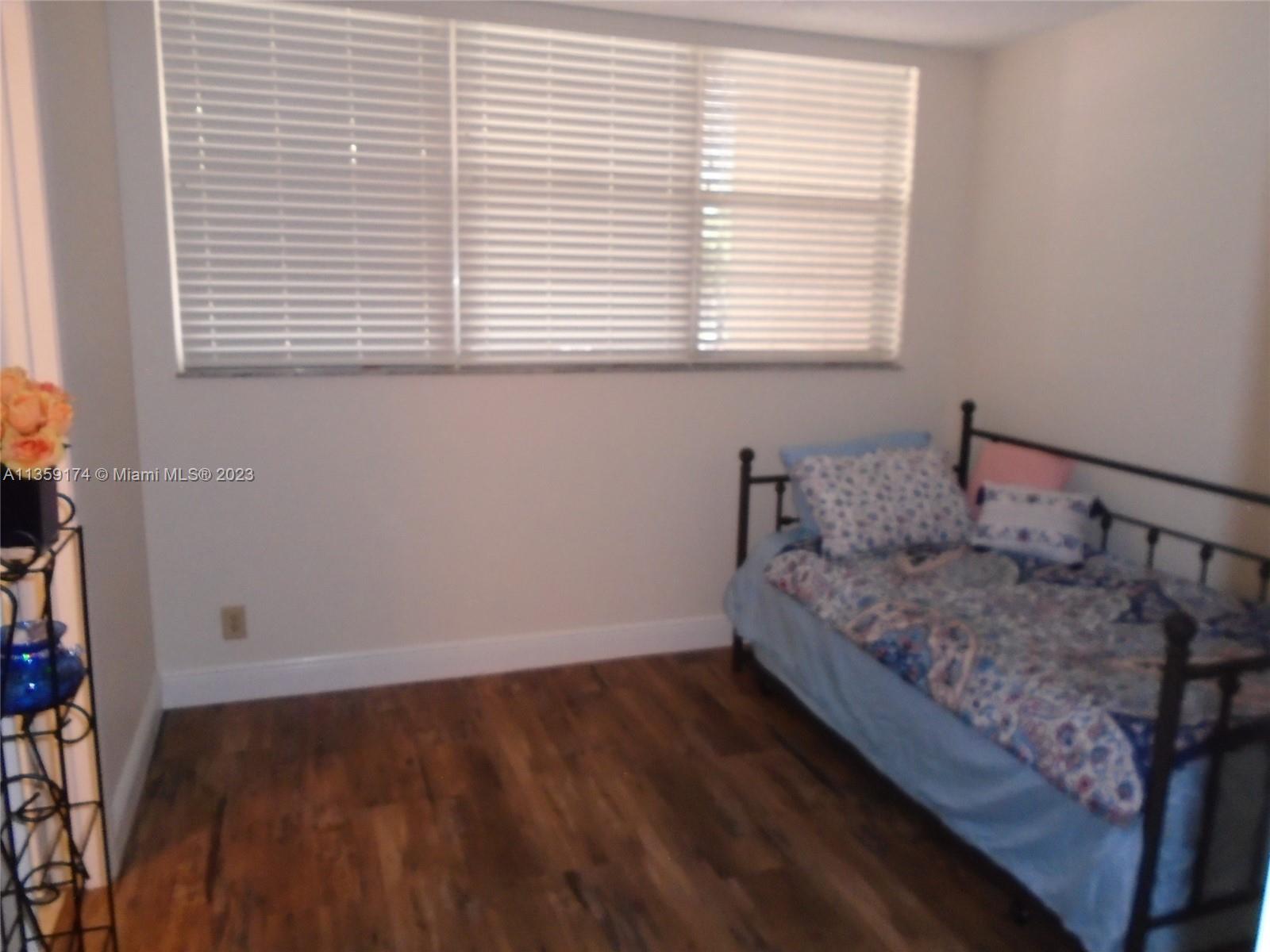 Sabal Palm of Pine Davie, FL 33324 - Photo 15 of 30 a bedroom with a bed and a window