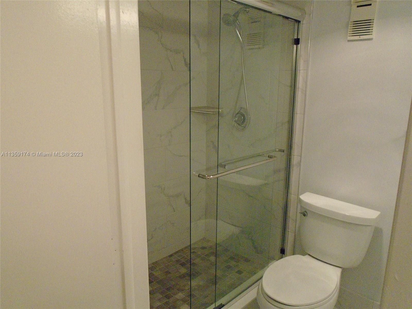 Sabal Palm of Pine Davie, FL 33324 - Photo 18 of 30 a bathroom with a toilet and a shower
