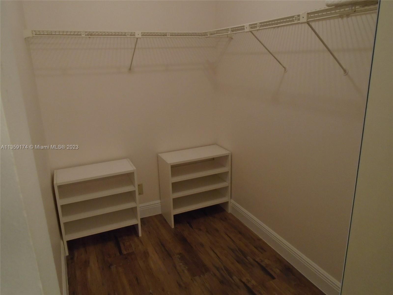 Sabal Palm of Pine Davie, FL 33324 - Photo 20 of 30 a view of walk in closet with empty racks