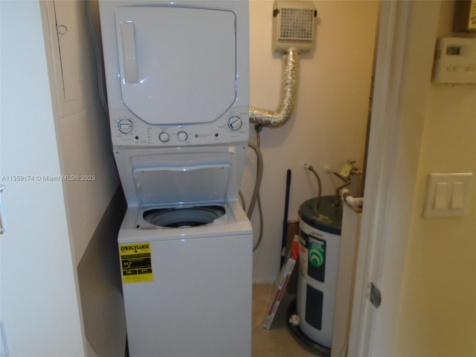 Sabal Palm of Pine Davie, FL 33324 - Photo 27 of 30 a utility room with dryer and washer