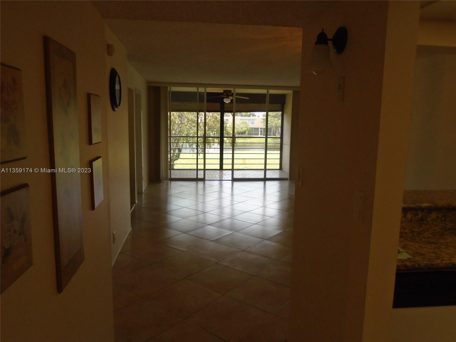Sabal Palm of Pine Davie, FL 33324 - Photo 4 of 30 a view of empty room with wooden floor and fan