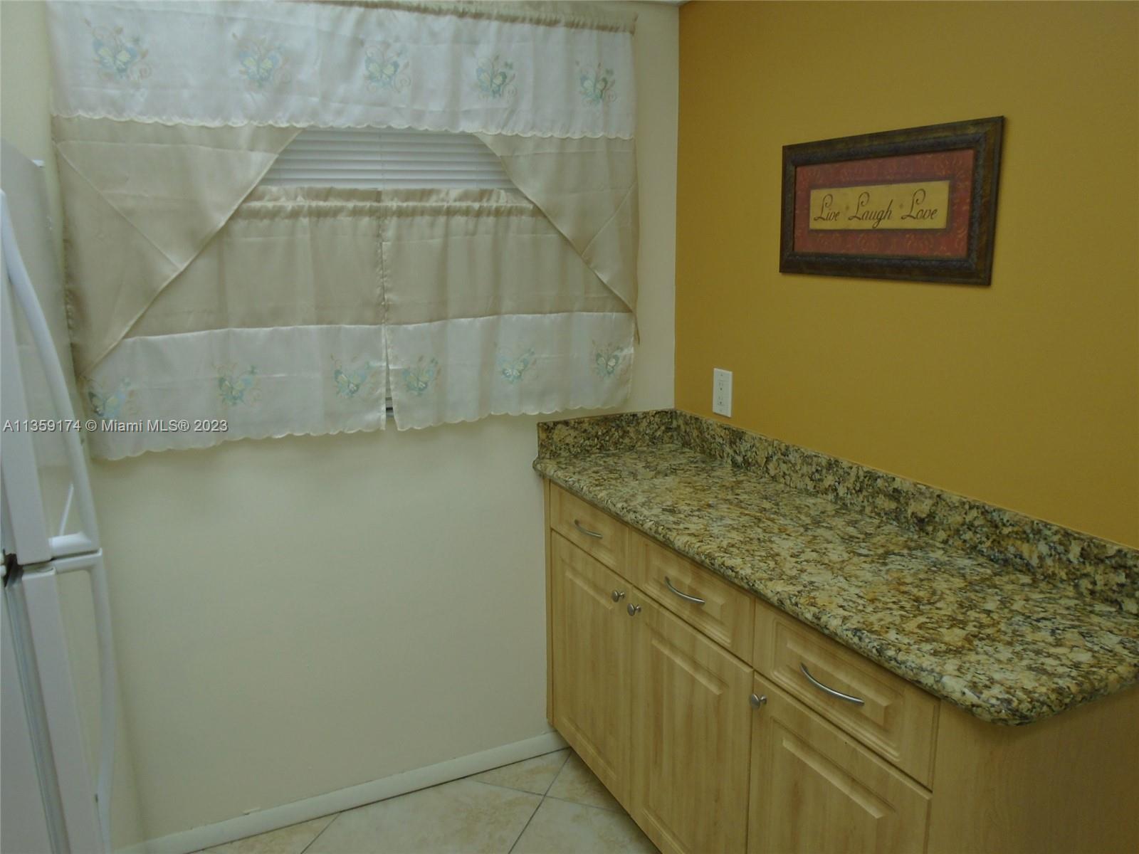 Sabal Palm of Pine Davie, FL 33324 - Photo 10 of 30 a bathroom with a granite countertop sink and vanity