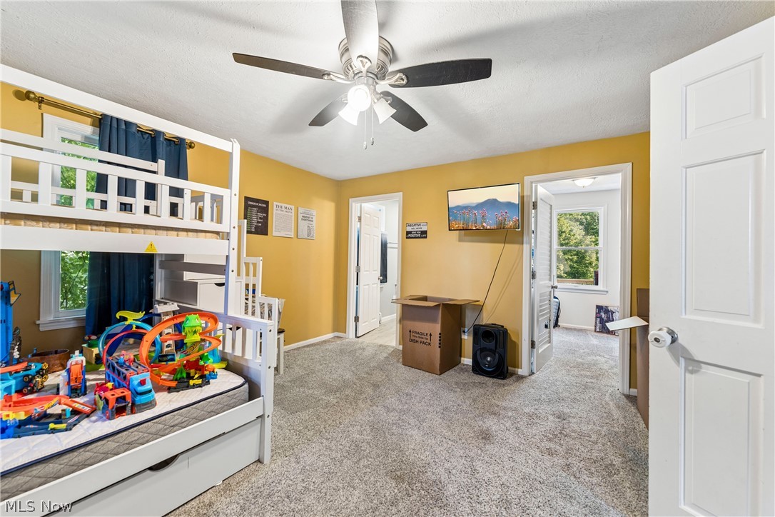 6711 Norwalk Road Medina, OH 44256 - Photo 30 of 46 Second floor bedroom with ceiling fan / light and carpet flooring