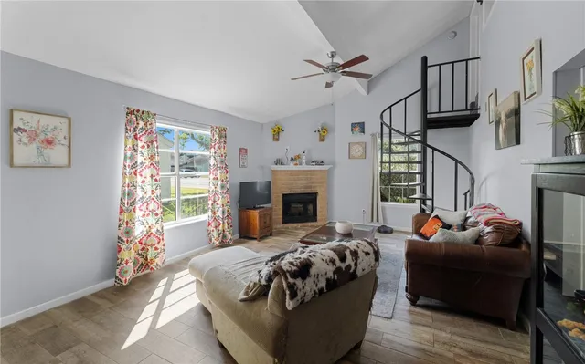 a bedroom with furniture and a fireplace