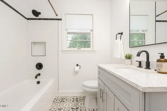 a bathroom with a sink a toilet and a bathtub