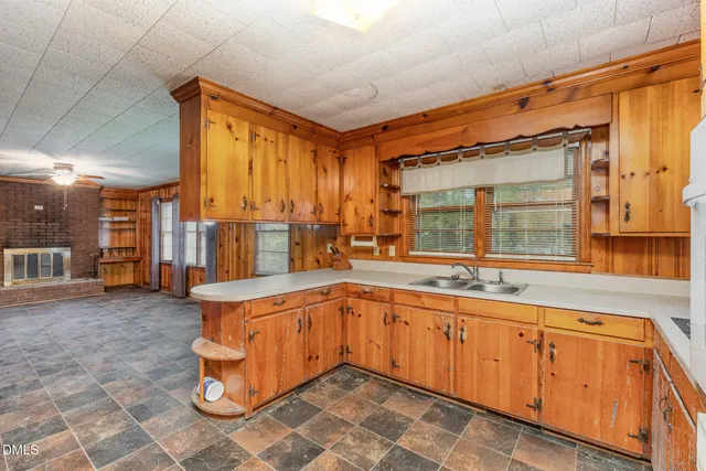 a large kitchen with a large window