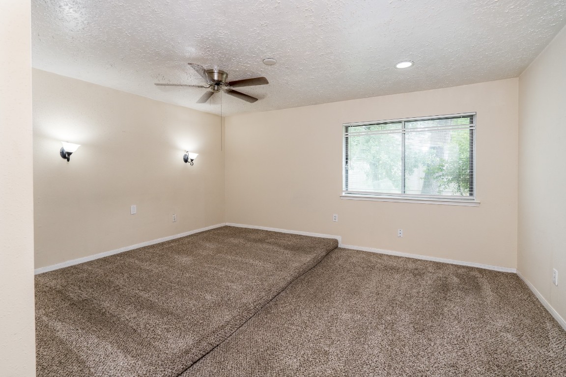 5018 Fitzwater Drive Spring, TX 77373 - Photo 18 of 27 Large Primary bedroom has carpet and a ceiling fan!