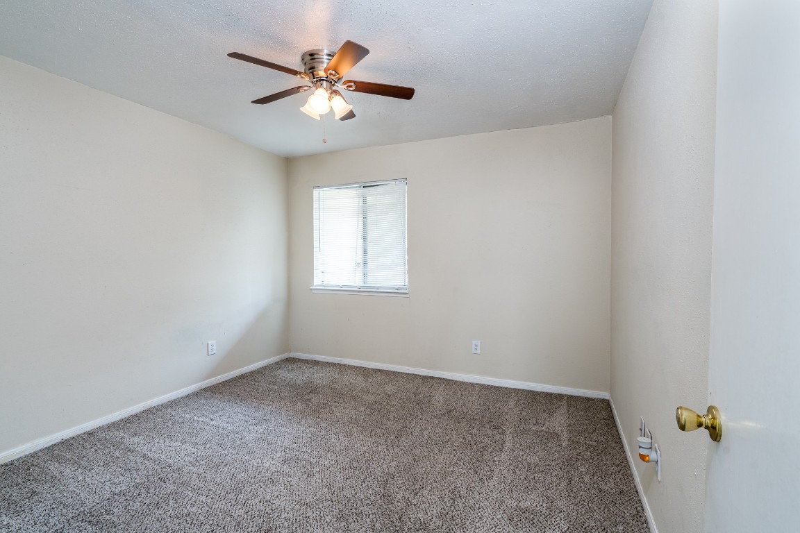 5018 Fitzwater Drive Spring, TX 77373 - Photo 23 of 27 Bedroom 1 features carpet and ceiling fan!