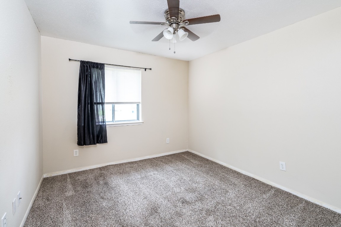 5018 Fitzwater Drive Spring, TX 77373 - Photo 25 of 27 Bedroom 2 features carpet and ceiling fan!
