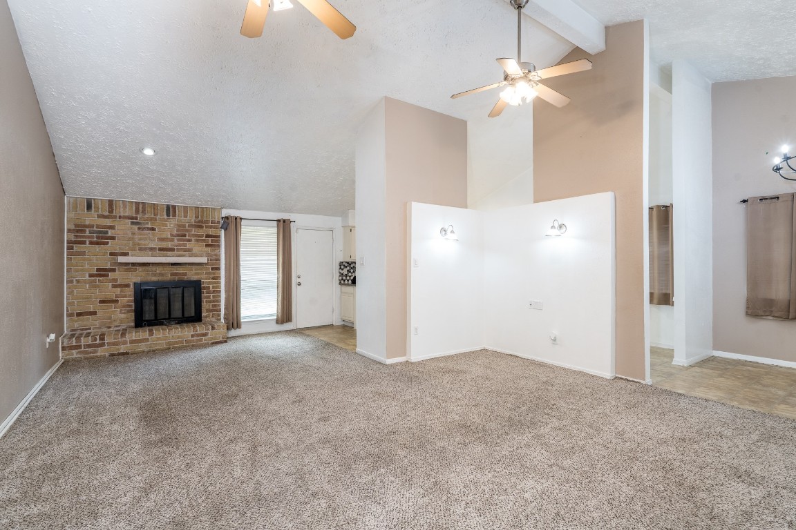 5018 Fitzwater Drive Spring, TX 77373 - Photo 9 of 27 Living room has cozy fireplace for cooler months!