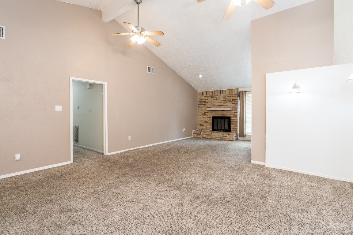 5018 Fitzwater Drive Spring, TX 77373 - Photo 10 of 27 Living room has carpet and a ceiling fan.