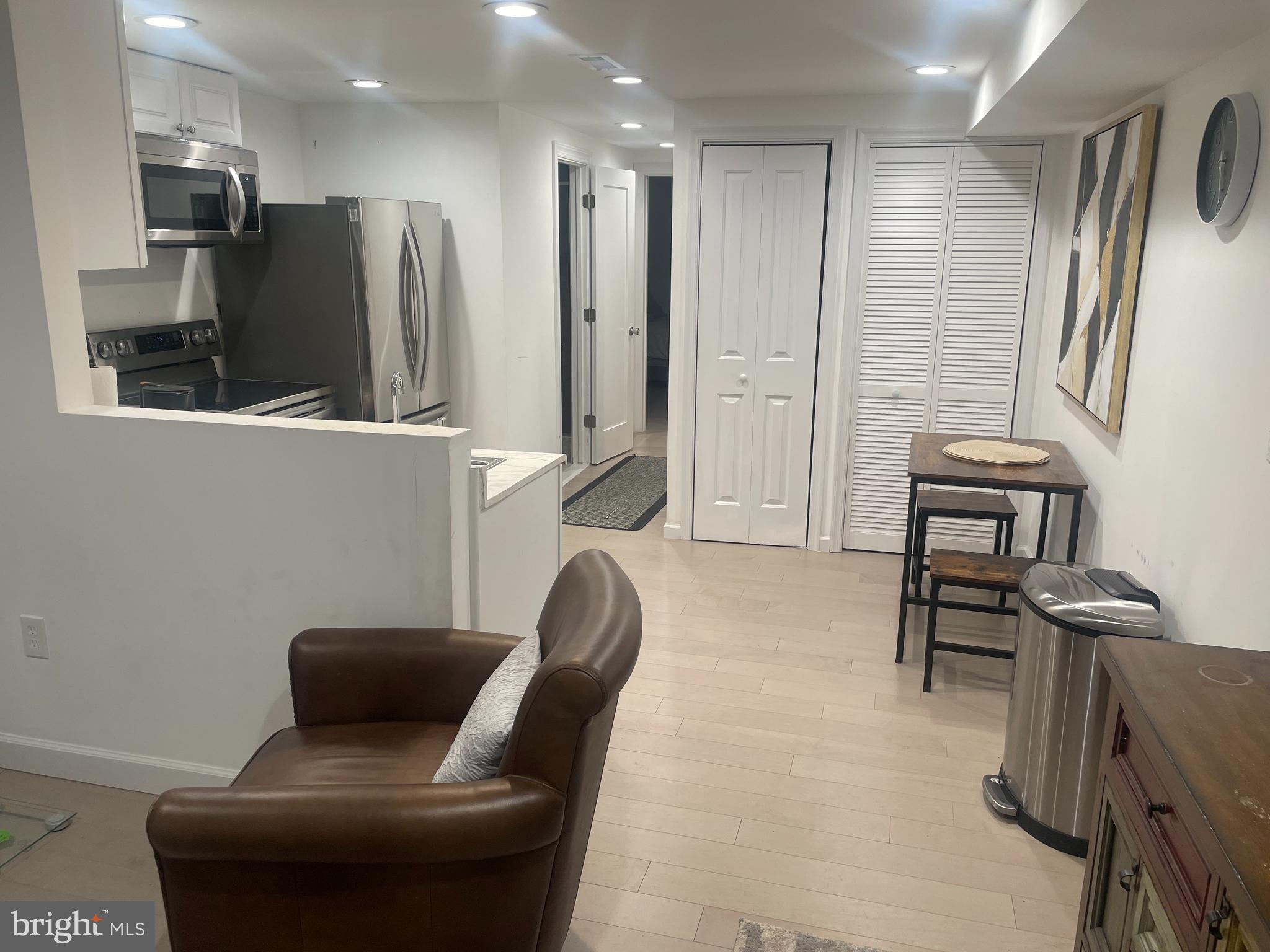 906 I Street Southeast, Unit 1 Washington, DC 20003 - Photo 6 of 19 a living room with furniture and a flat screen tv