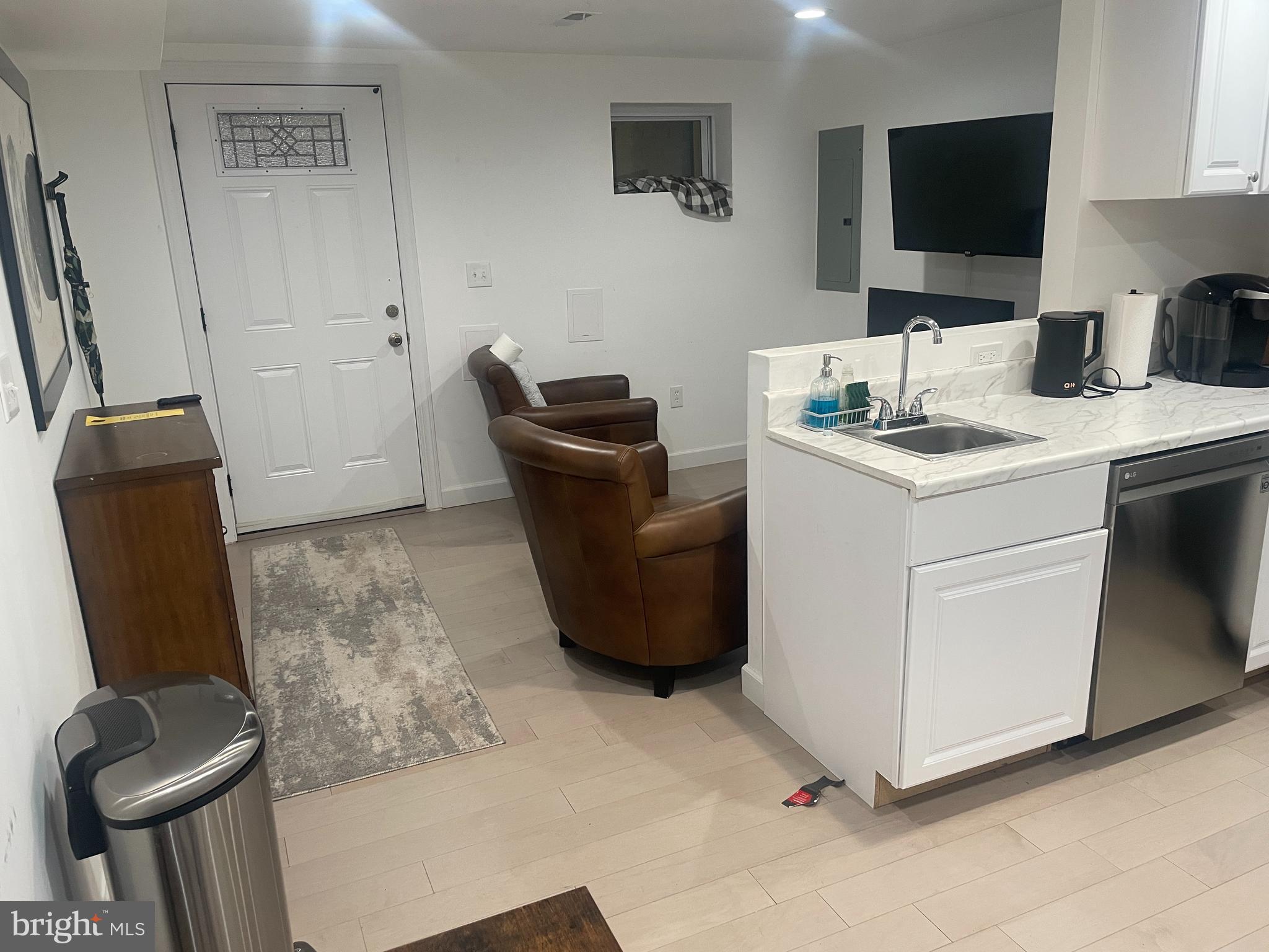 906 I Street Southeast, Unit 1 Washington, DC 20003 - Photo 8 of 19 a living room with furniture and a flat screen tv