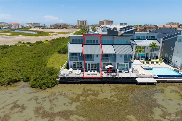 a view of a swimming pool with a table and chairs