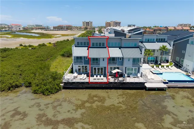 a view of a swimming pool with a table and chairs