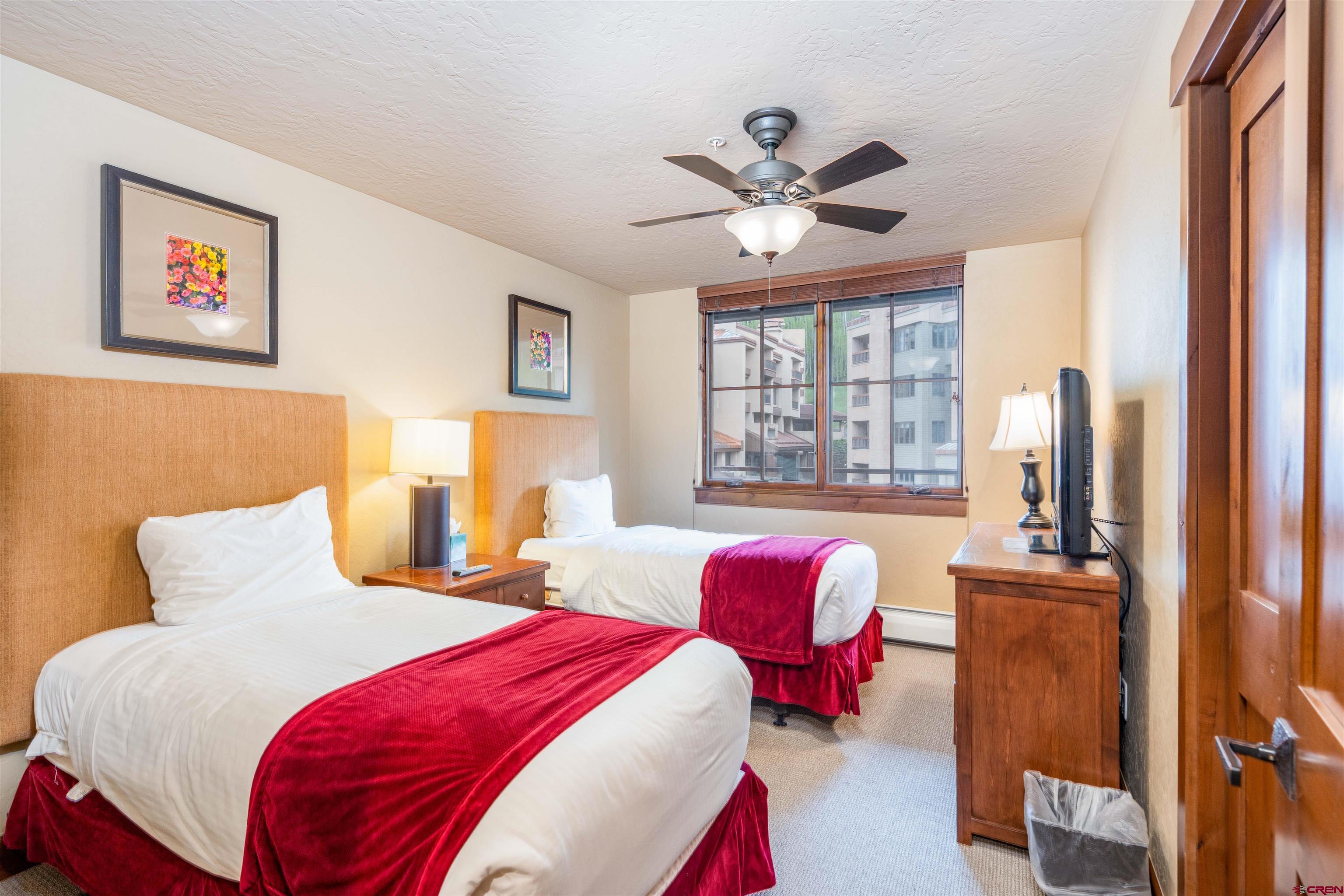 24 Sheol Street, Unit 204 Durango, CO 81301 - Photo 13 of 29 a bedroom with a bed and a large window