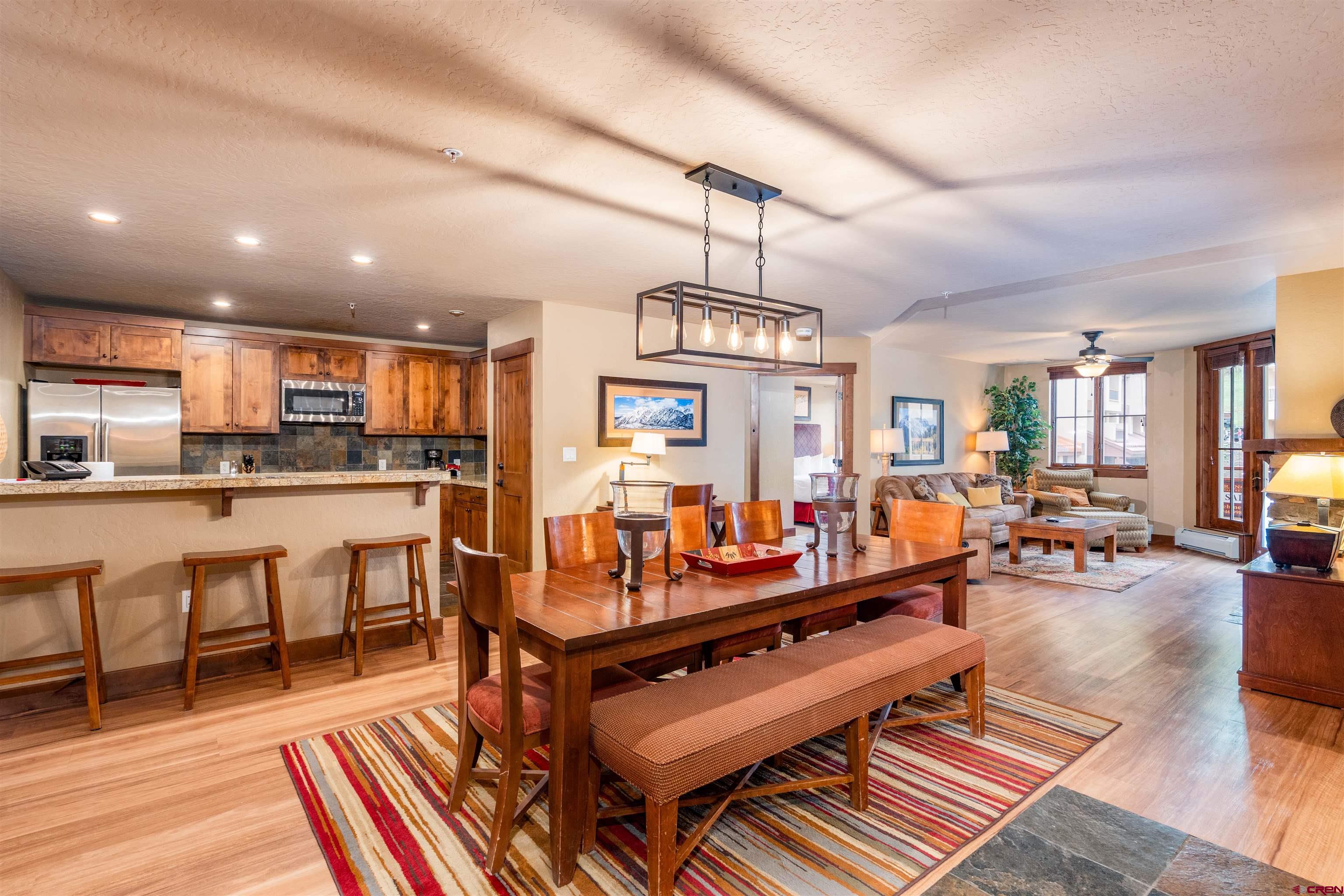 24 Sheol Street, Unit 204 Durango, CO 81301 - Photo 3 of 29 a living room with lots of furniture and kitchen view