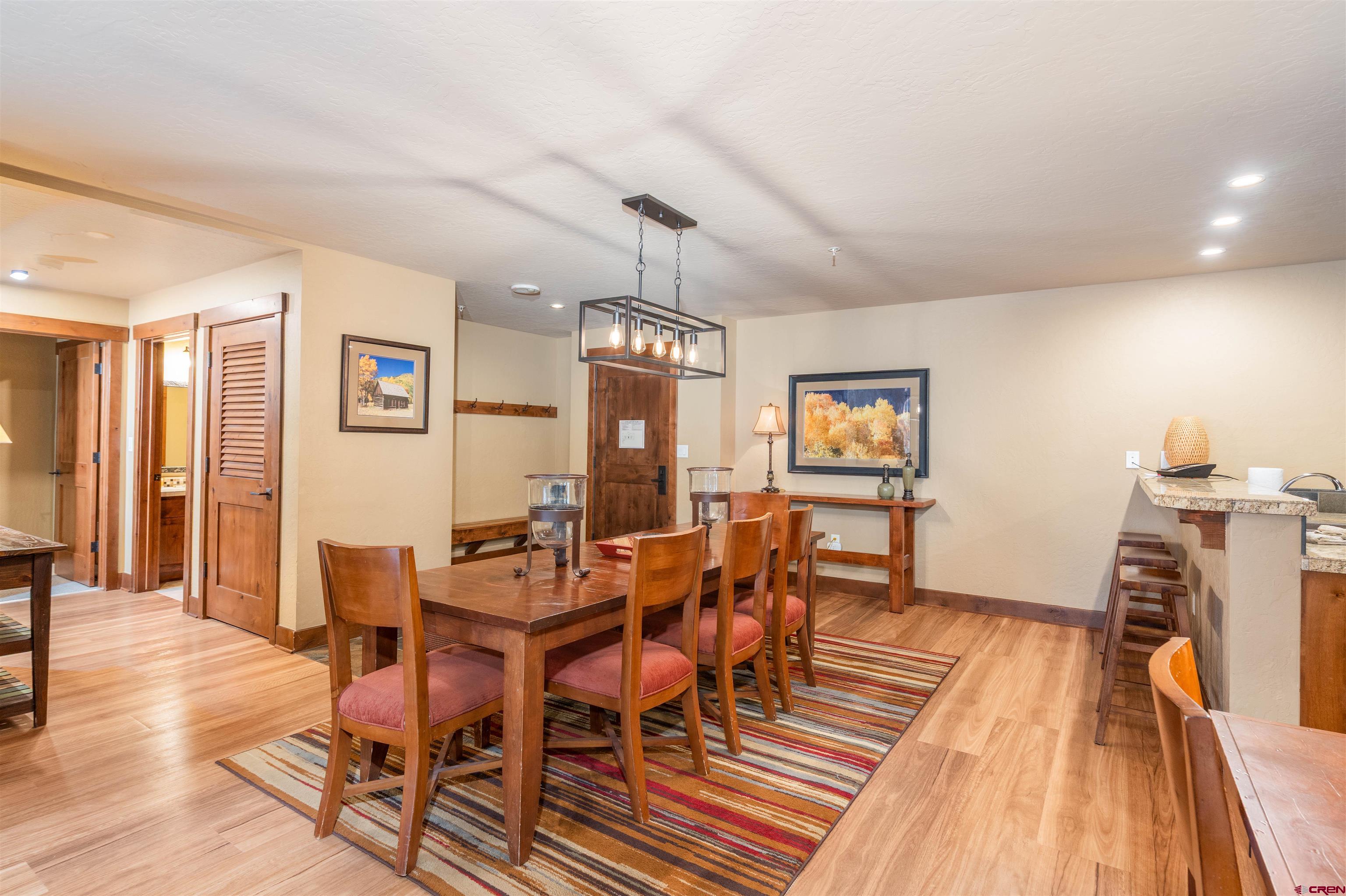 24 Sheol Street, Unit 204 Durango, CO 81301 - Photo 6 of 29 a view of a dining room with furniture and wooden floor
