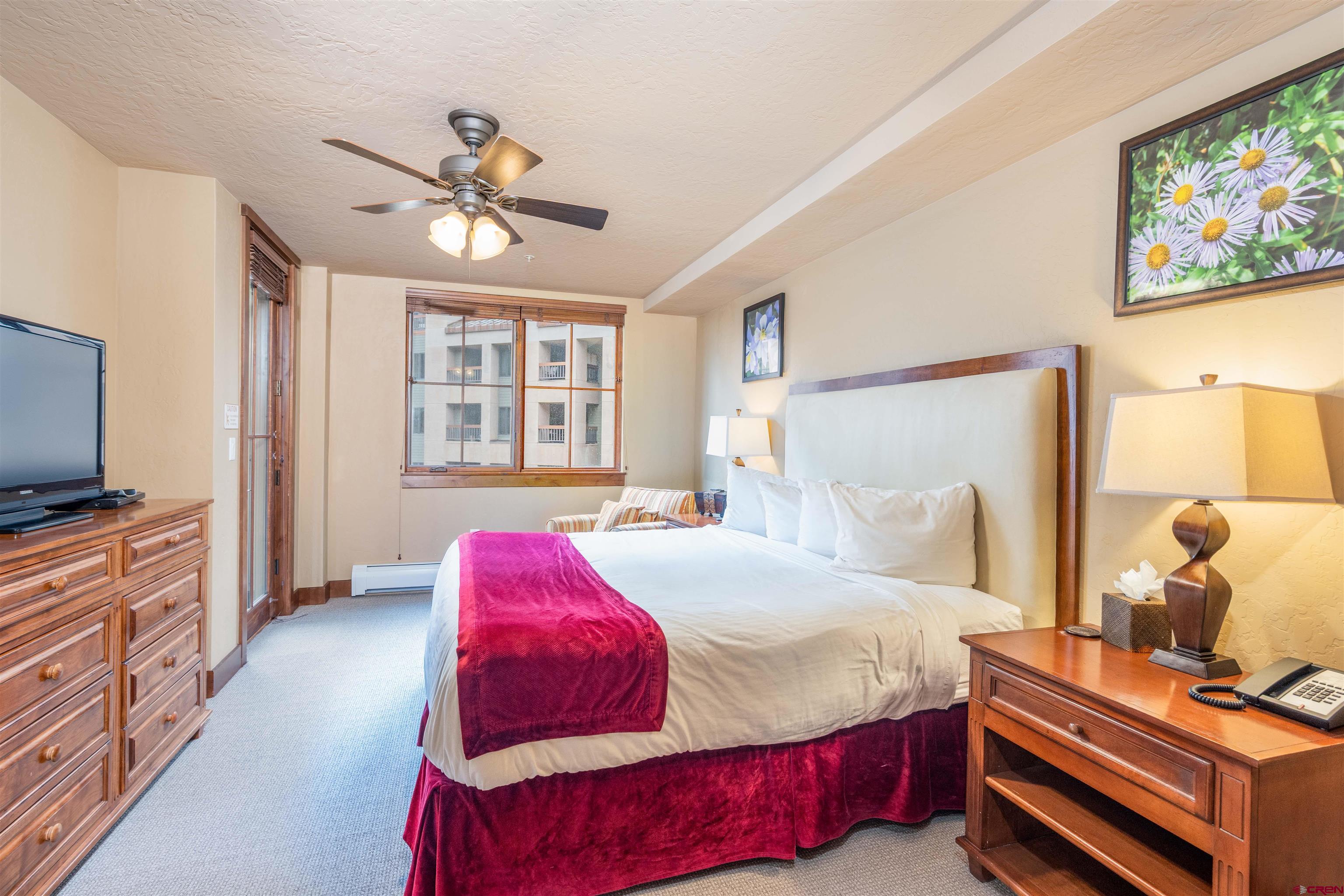 24 Sheol Street, Unit 204 Durango, CO 81301 - Photo 10 of 29 a bedroom with a bed and a flat screen tv