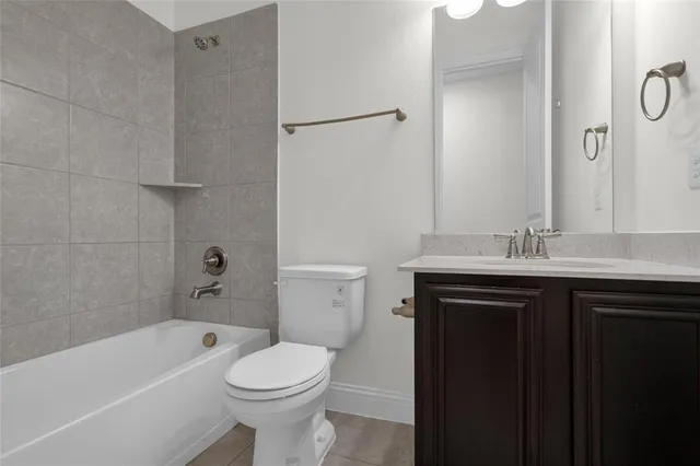 a bathroom with a sink a toilet and bathtub