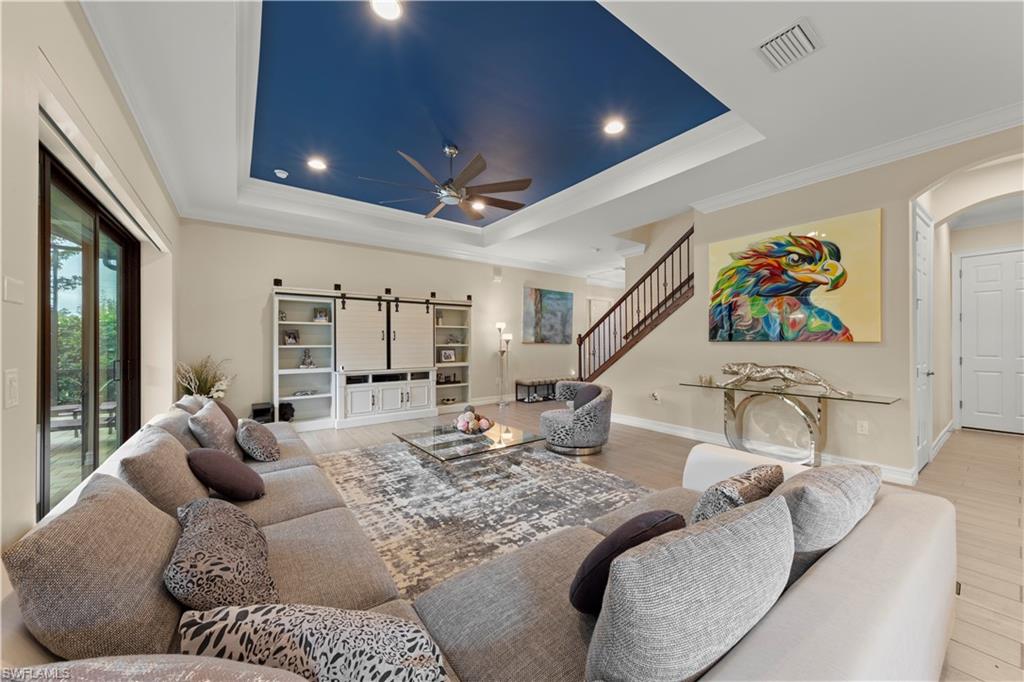 1608 Mockingbird Drive Naples, FL 34120 - Photo 12 of 29 a living room with furniture and a large window