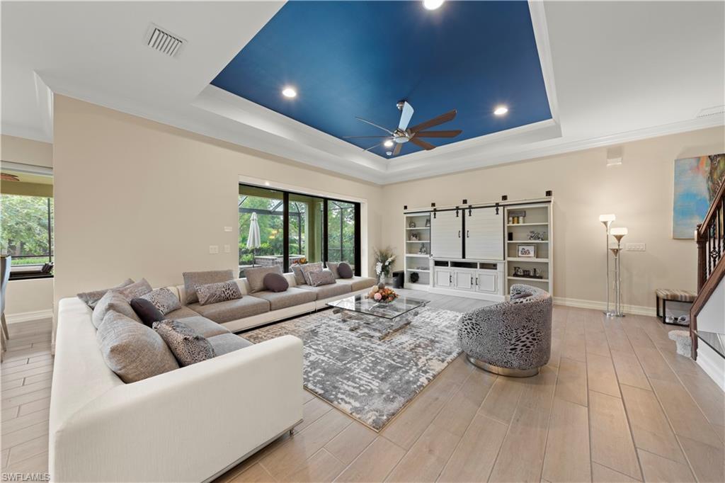 1608 Mockingbird Drive Naples, FL 34120 - Photo 13 of 29 a living room with furniture and a large window