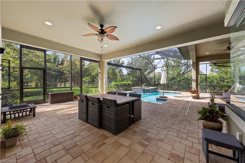1608 Mockingbird Drive Naples, FL 34120 - Photo 18 of 29 a living room with furniture and a large window