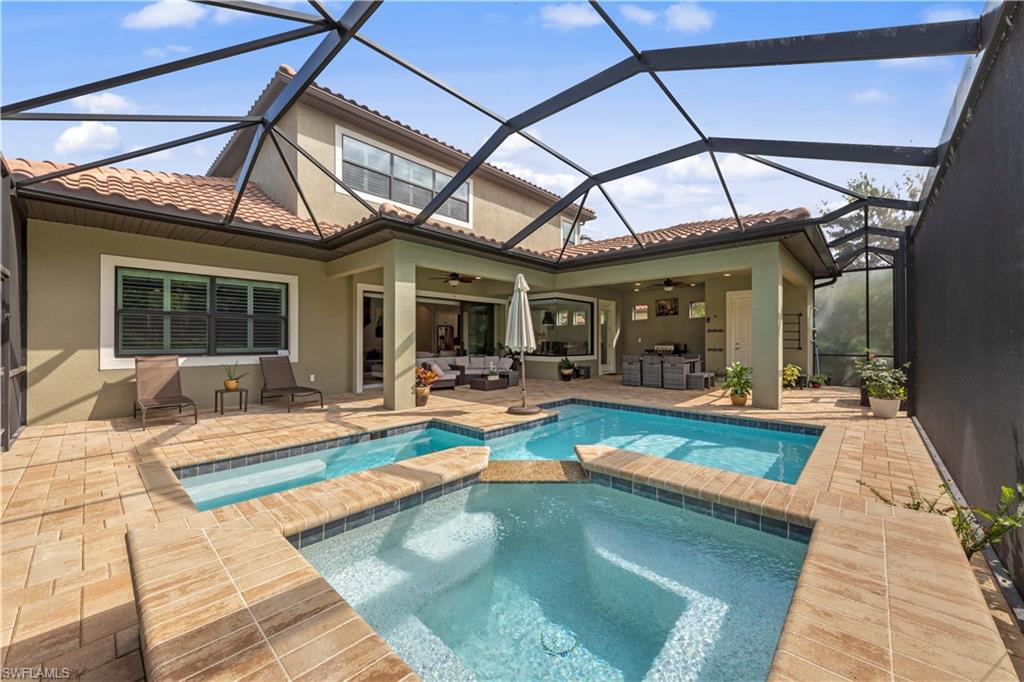 1608 Mockingbird Drive Naples, FL 34120 - Photo 19 of 29 a view of a patio with swimming pool table and chairs