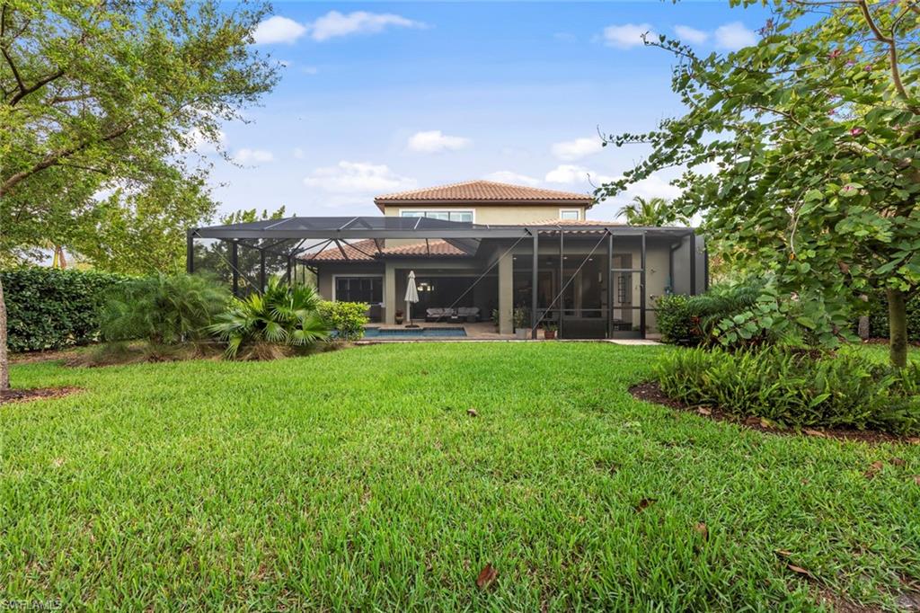 1608 Mockingbird Drive Naples, FL 34120 - Photo 29 of 29 a view of a porch with a yard