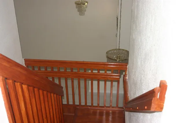 a swimming pool with outdoor seating and yard