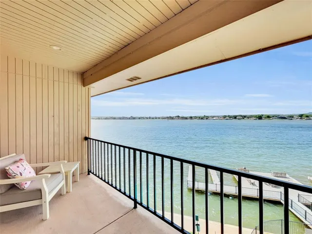 an aerial view of a house with a lake view