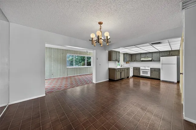 a view of a kitchen with a sink cabinets and window