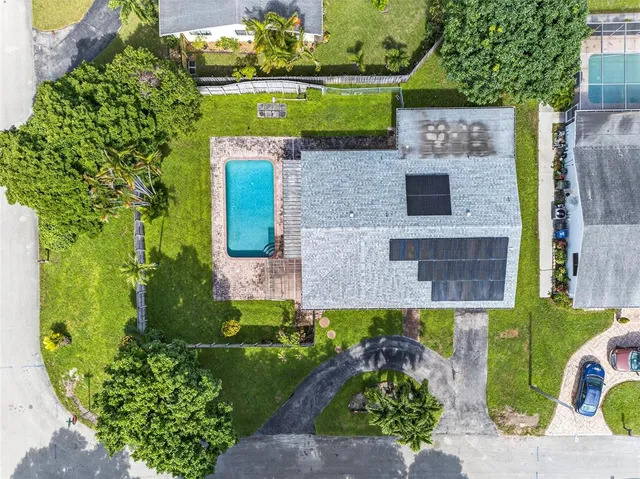 an aerial view of a house with a garden