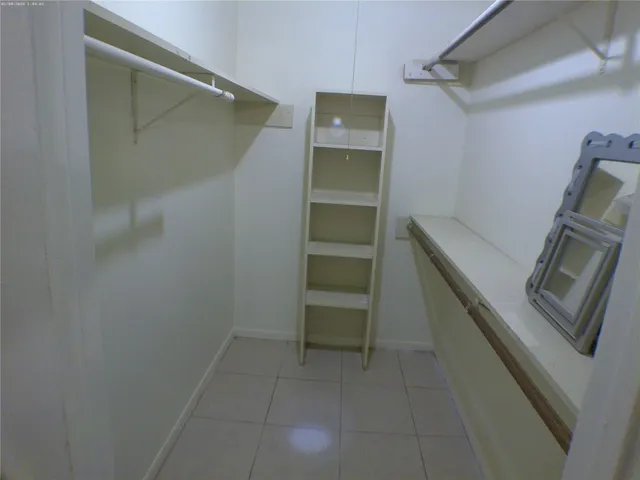 a view of an empty walk in closet