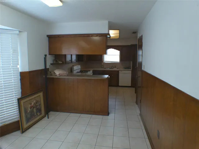 a kitchen with a stove and a microwave