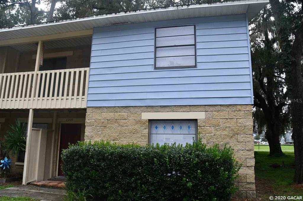 a front view of a house with garage