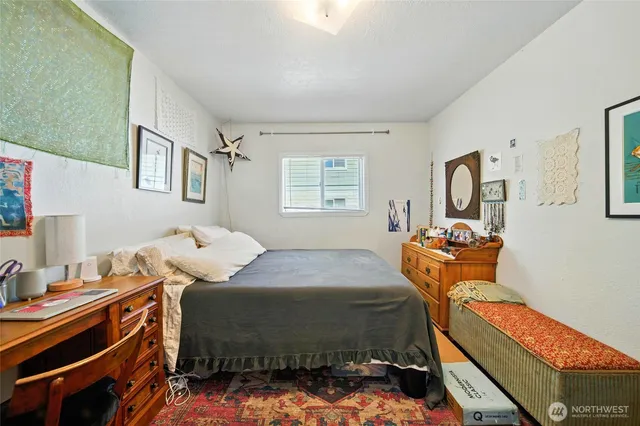 a bedroom with bed and a window