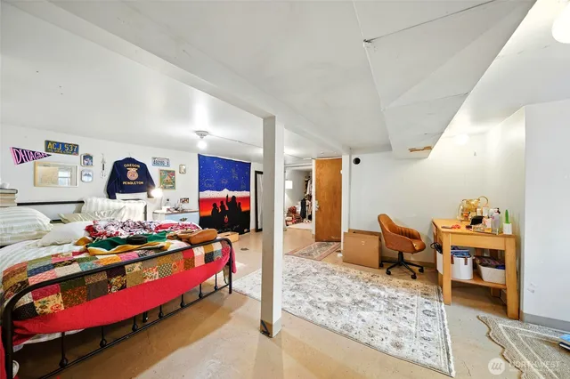 a bedroom with furniture and a bed