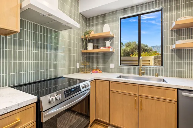 a bedroom with a bed and a potted plant