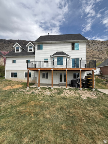 965 North 800 East Springville, UT 84663 - Photo 7 of 46 Back of house with a deck, a patio, and a lawn