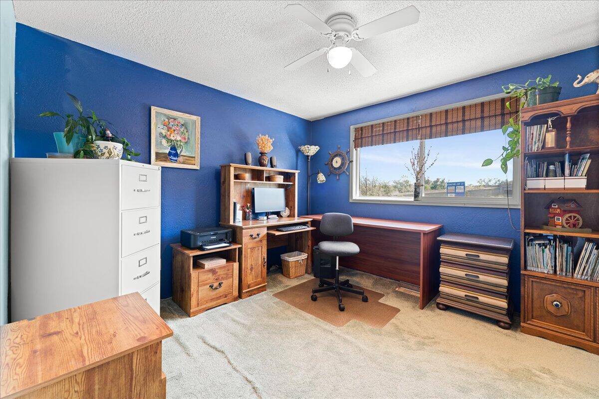 4093 Old Upton Road Central Point, OR 97502 - Photo 15 of 23 a view of a workspace with furniture and a window