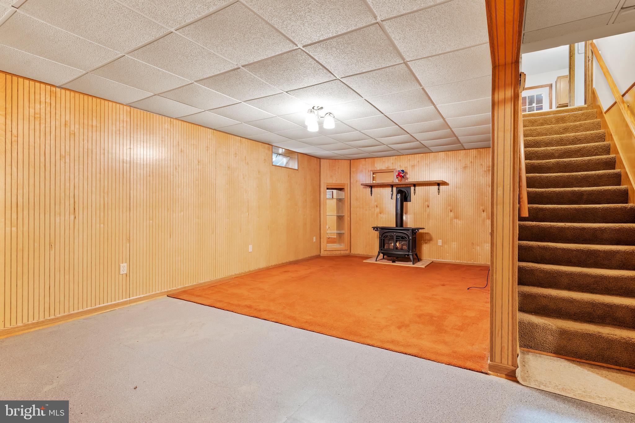 611 Alexander Spring Road Carlisle, PA 17015 - Photo 22 of 30 Family room in basement with gas stove