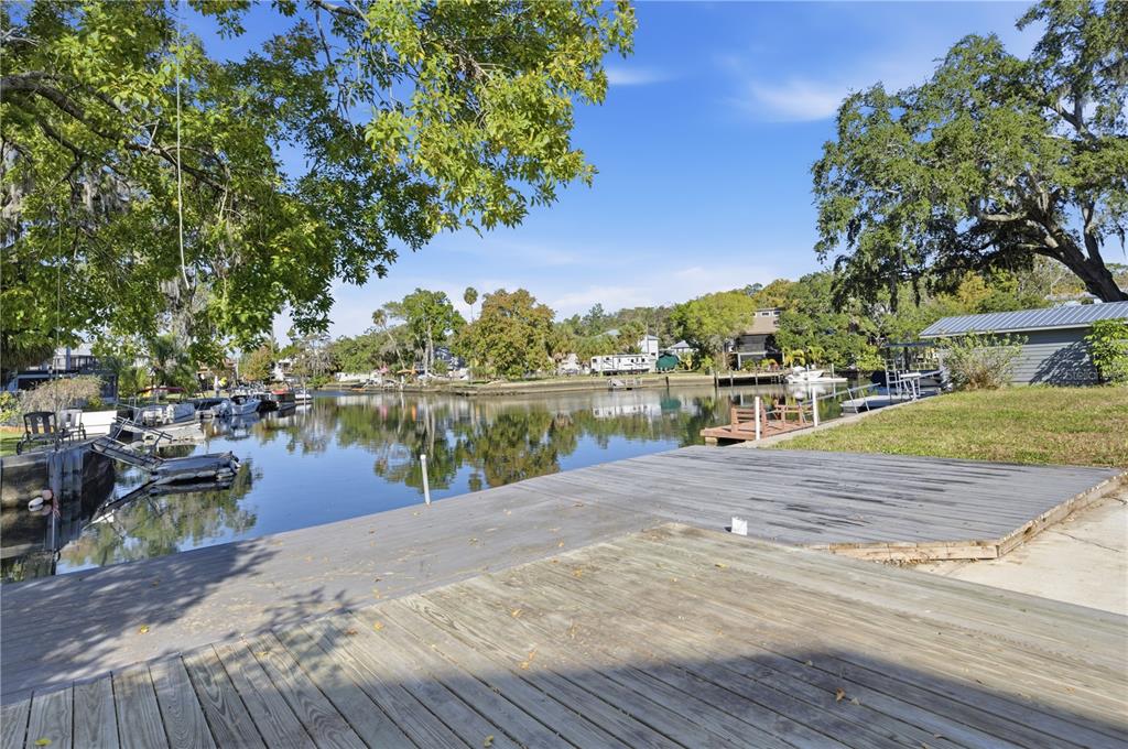 0 Circle Drive Weeki Wachee, FL 34607 - Photo 7 of 14 a wooden pier with boats and lake view