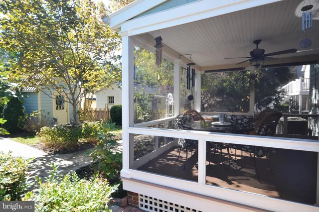 a view of a house with a flower garden