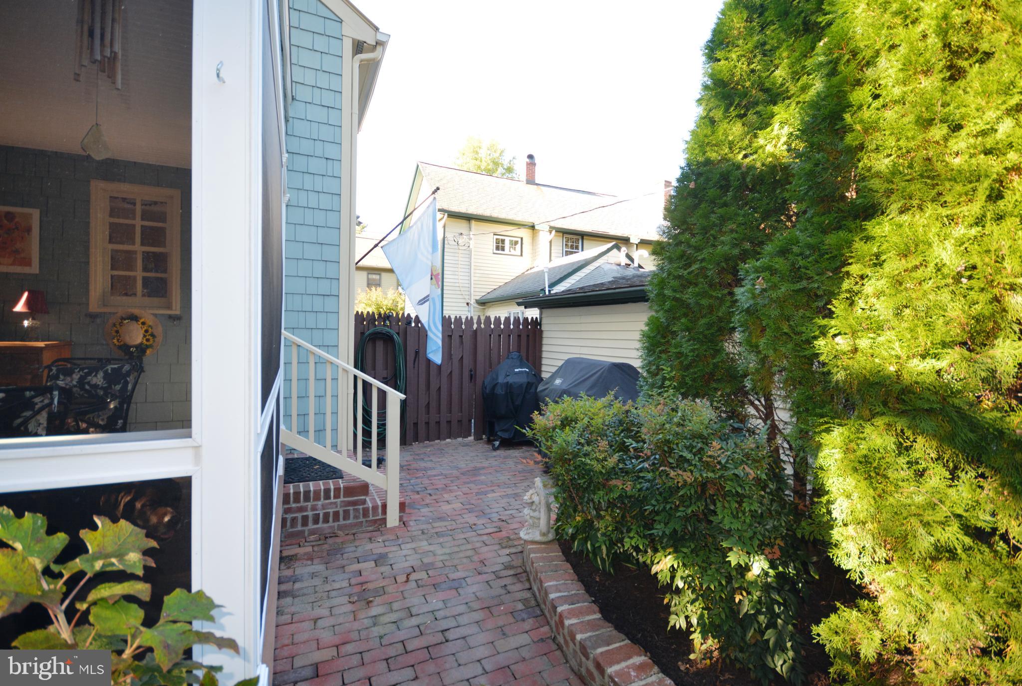 106 Grace Street St. Michaels, MD 21663 - Photo 15 of 57 a view of a house with a flower garden