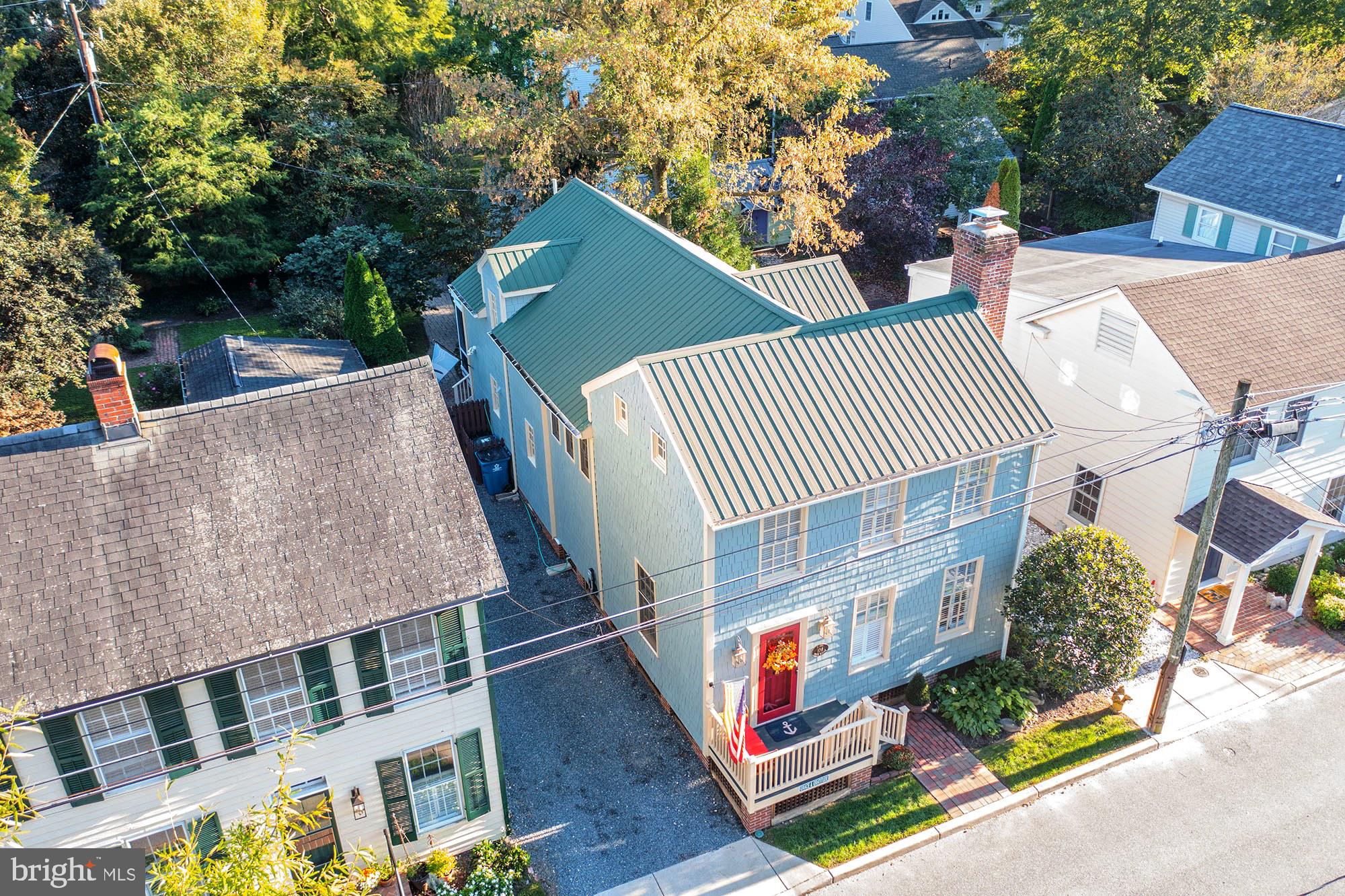 106 Grace Street St. Michaels, MD 21663 - Photo 2 of 57 a view of a roof deck with couches and wooden floor