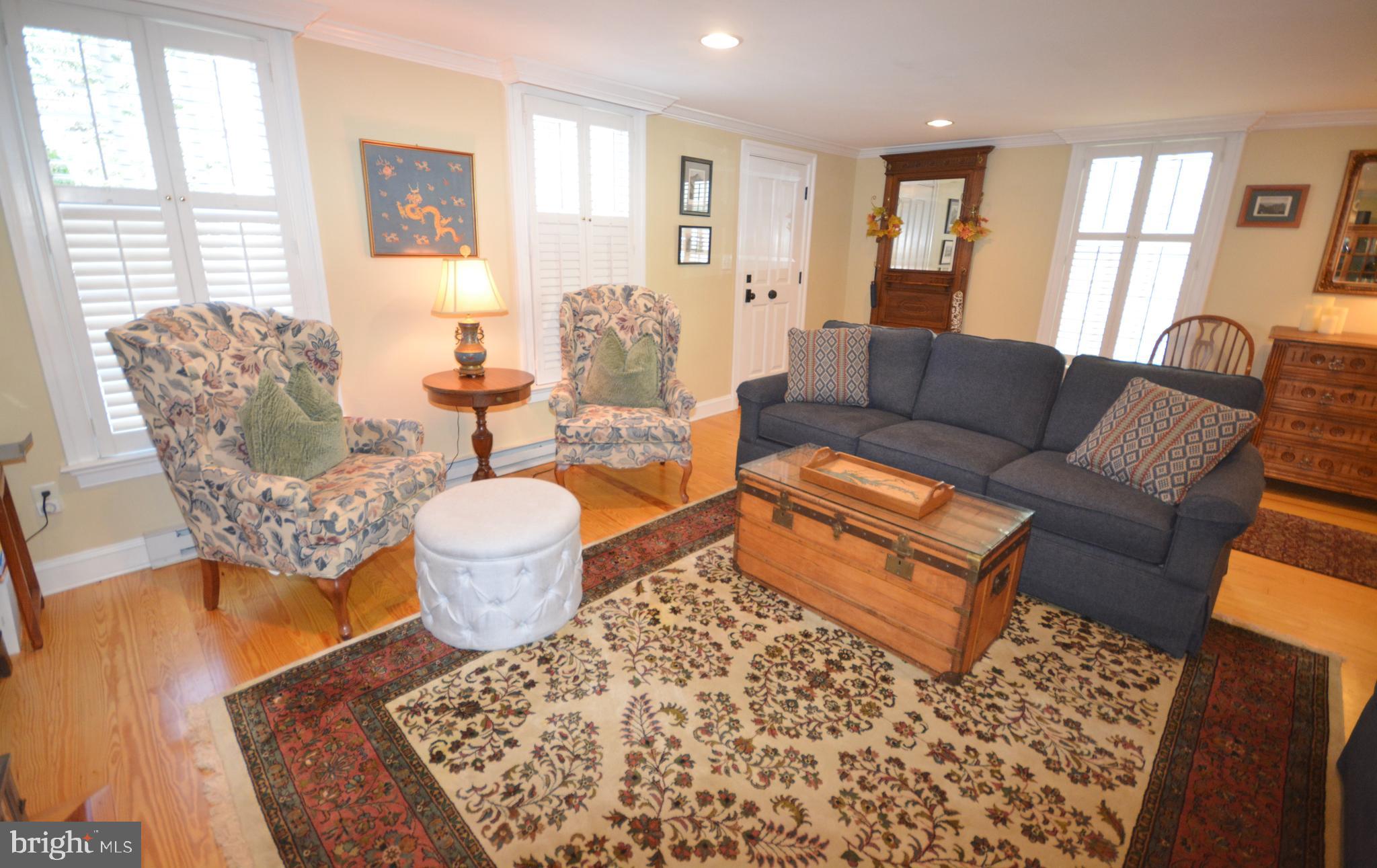 106 Grace Street St. Michaels, MD 21663 - Photo 22 of 57 a living room with furniture and a large window