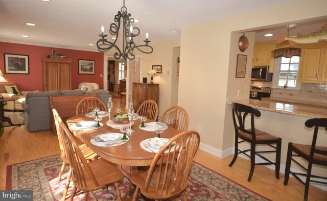 a kitchen with granite countertop a sink stove and cabinets
