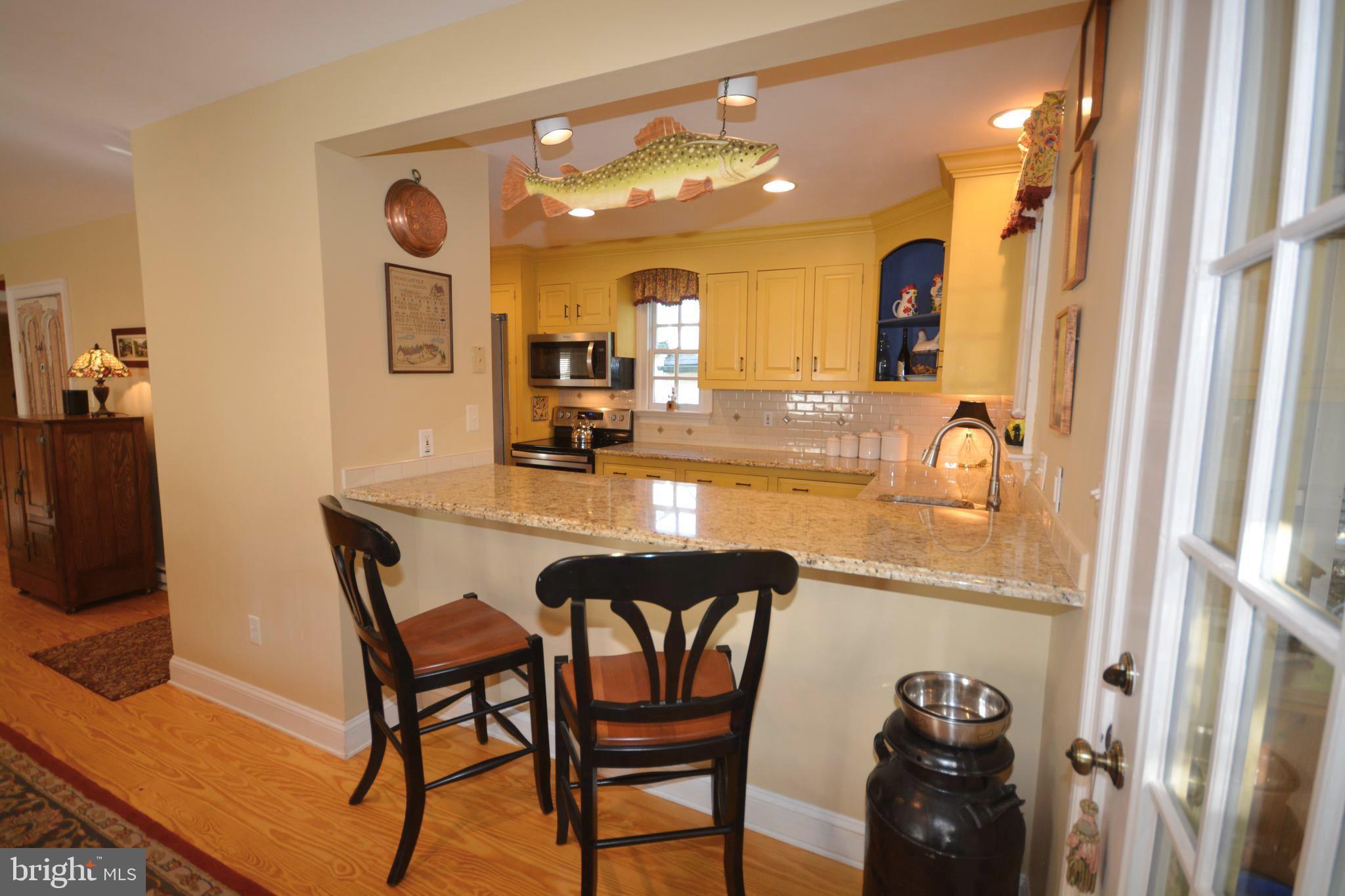 106 Grace Street St. Michaels, MD 21663 - Photo 31 of 57 a view of a dining room with furniture and a chandelier