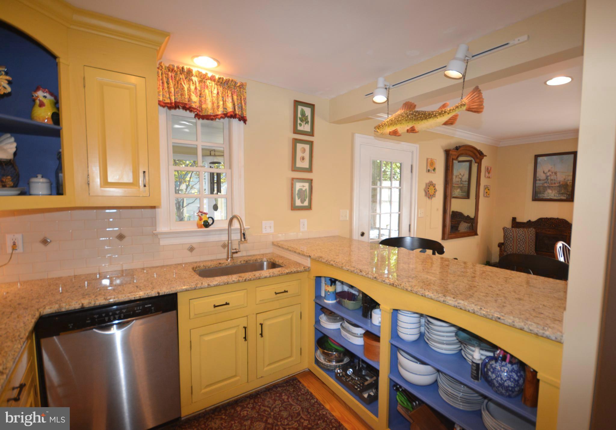 106 Grace Street St. Michaels, MD 21663 - Photo 33 of 57 a kitchen with a sink stove and cabinets